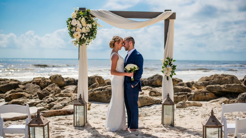 bride and groom arbor reasons for beach wedding