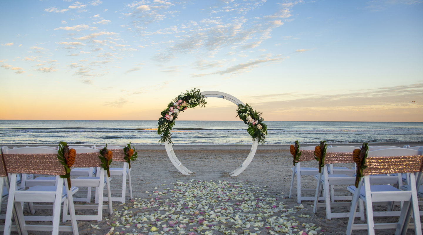 Circular arch wedding ceremony set up on a beach