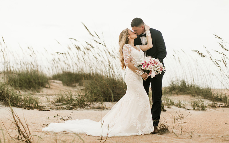 Bride and groom kissing on a gulf Florida beach